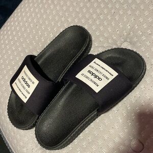 Alexander wang collabs with ADIDAS to make these sick slides. Barely used